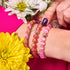 Hochet rose | Bracelet de perles de verre de l'Himalaya